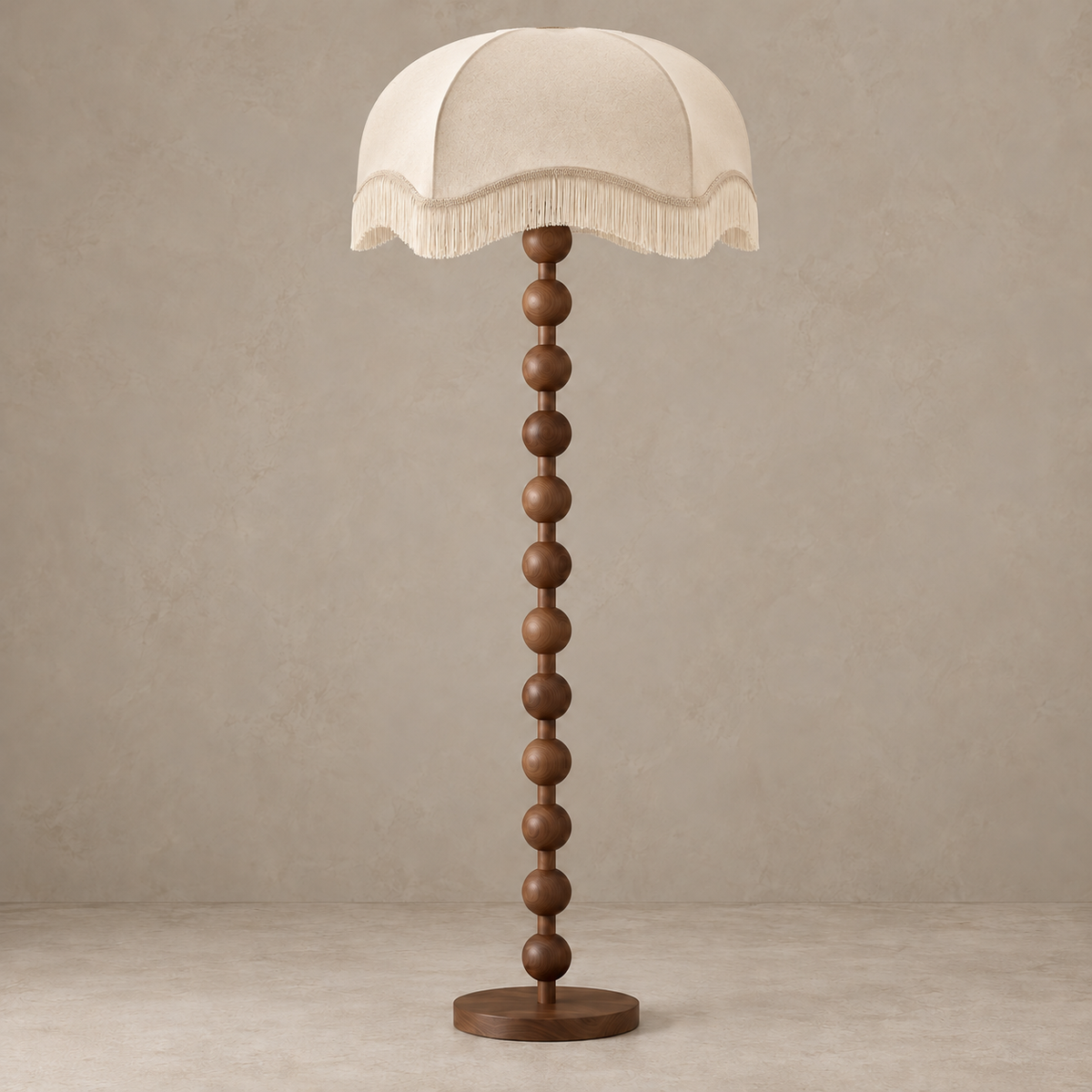 Sirmione walnut floor lamp with a broad cream scalloped fringe shade, switched off.