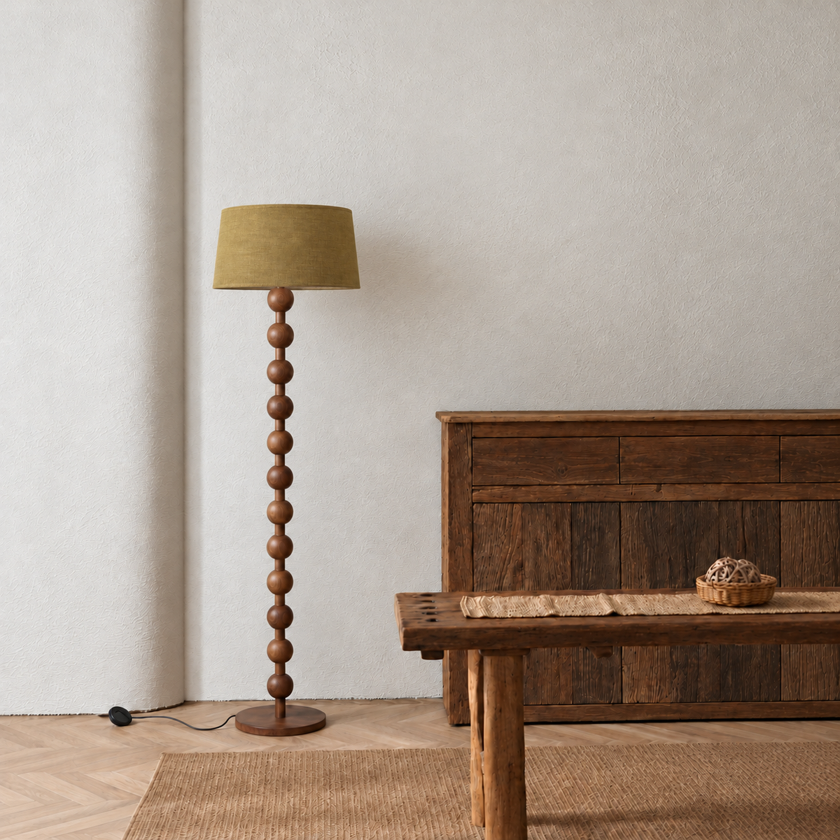 Sirmione Walnut Floor Lamp with olive linen shade in a furnished room.