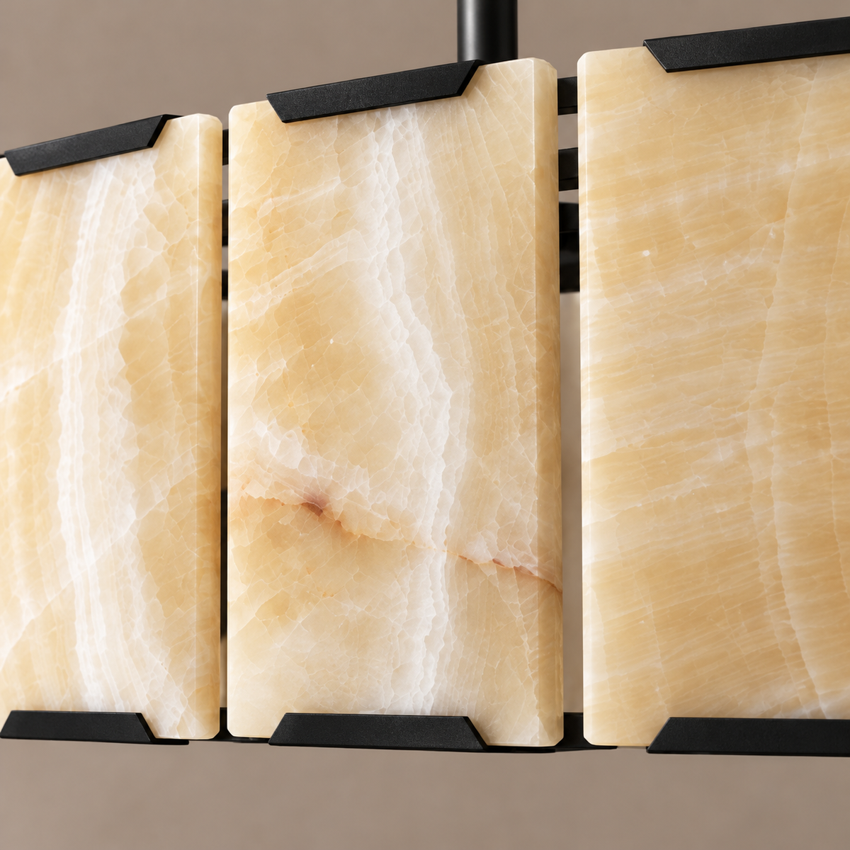 Honey onyx panels and black corner brackets on the halo chandelier.