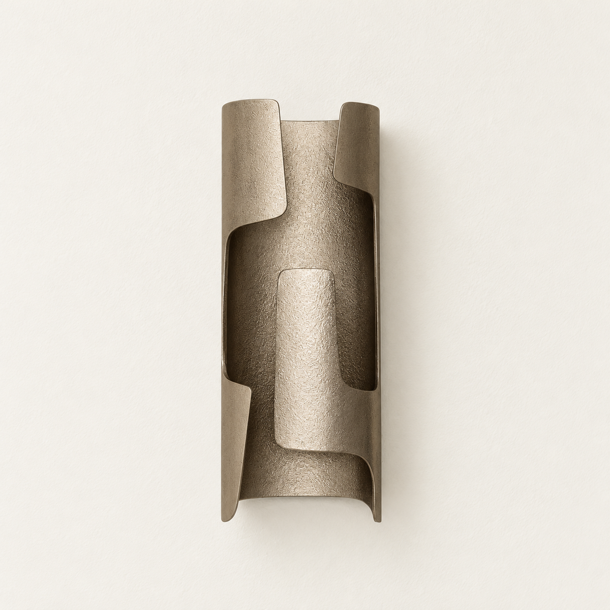 Unlit champagne bronze-finish wall sconce with overlapping curved metal panels, viewed from the front.