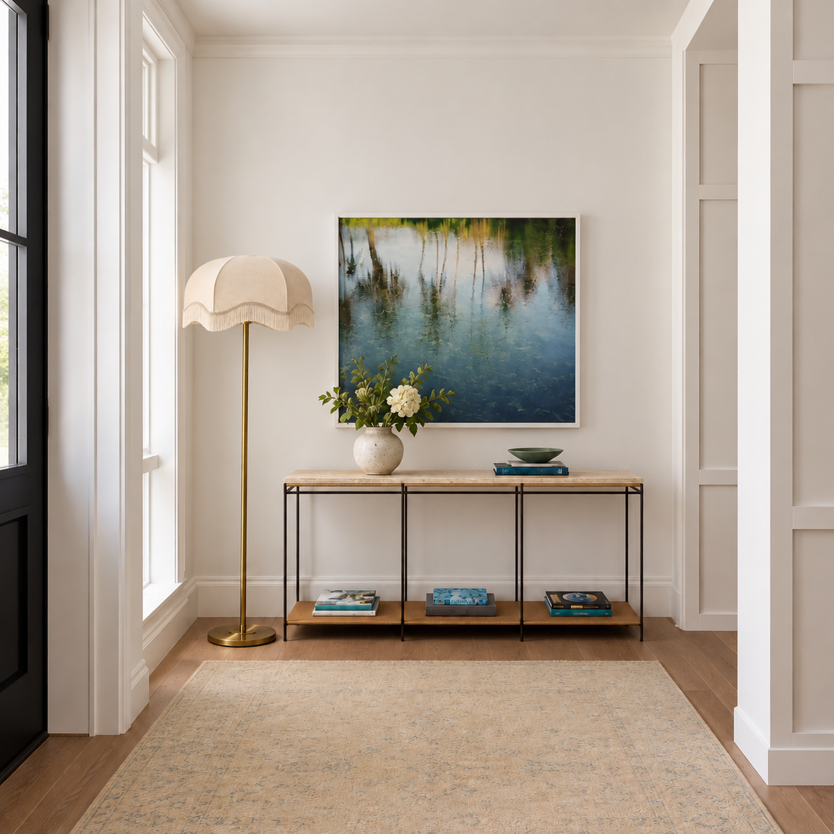 Brushed Brass Floor Lamp with cream scalloped fringe shade in a furnished room.