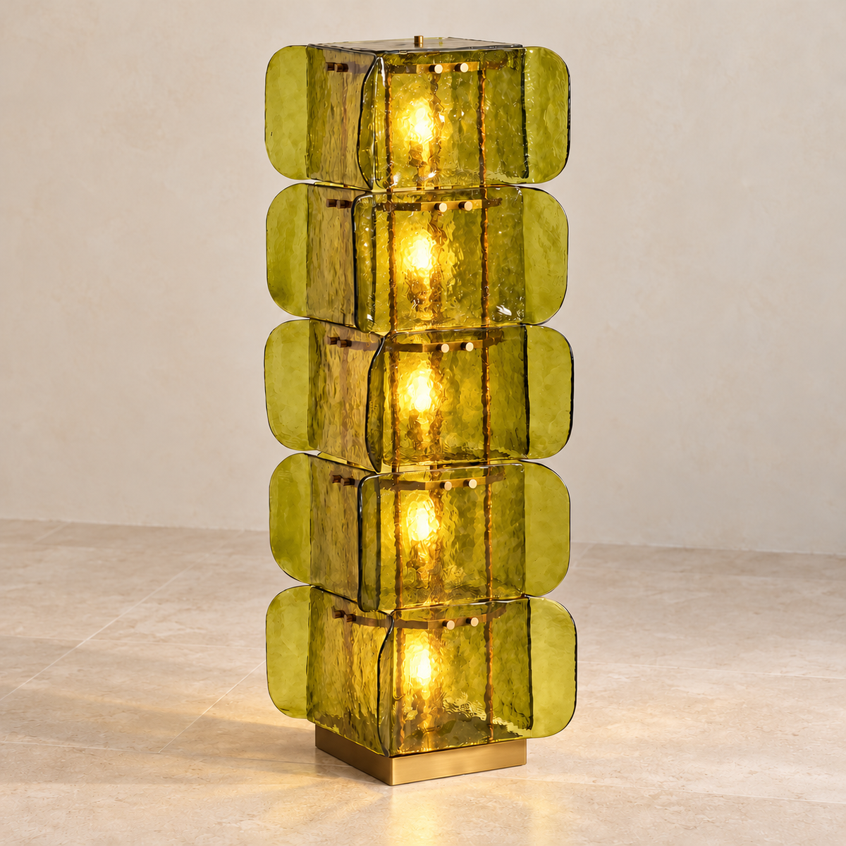 Green glass floor lamp illuminated through five tiers of rippled glass.