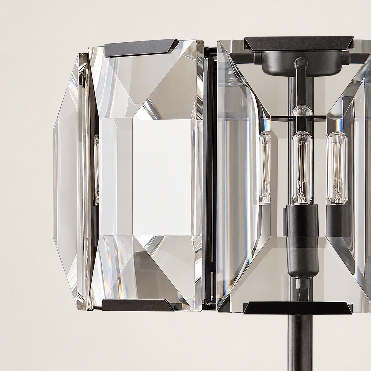 Close view of the Trieste lamp's clear beveled crystal panels and dark metal shade frame.