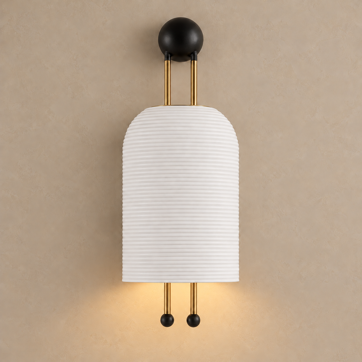Verona matte ceramic wall sconce switched on, casting a soft glow below the shade.