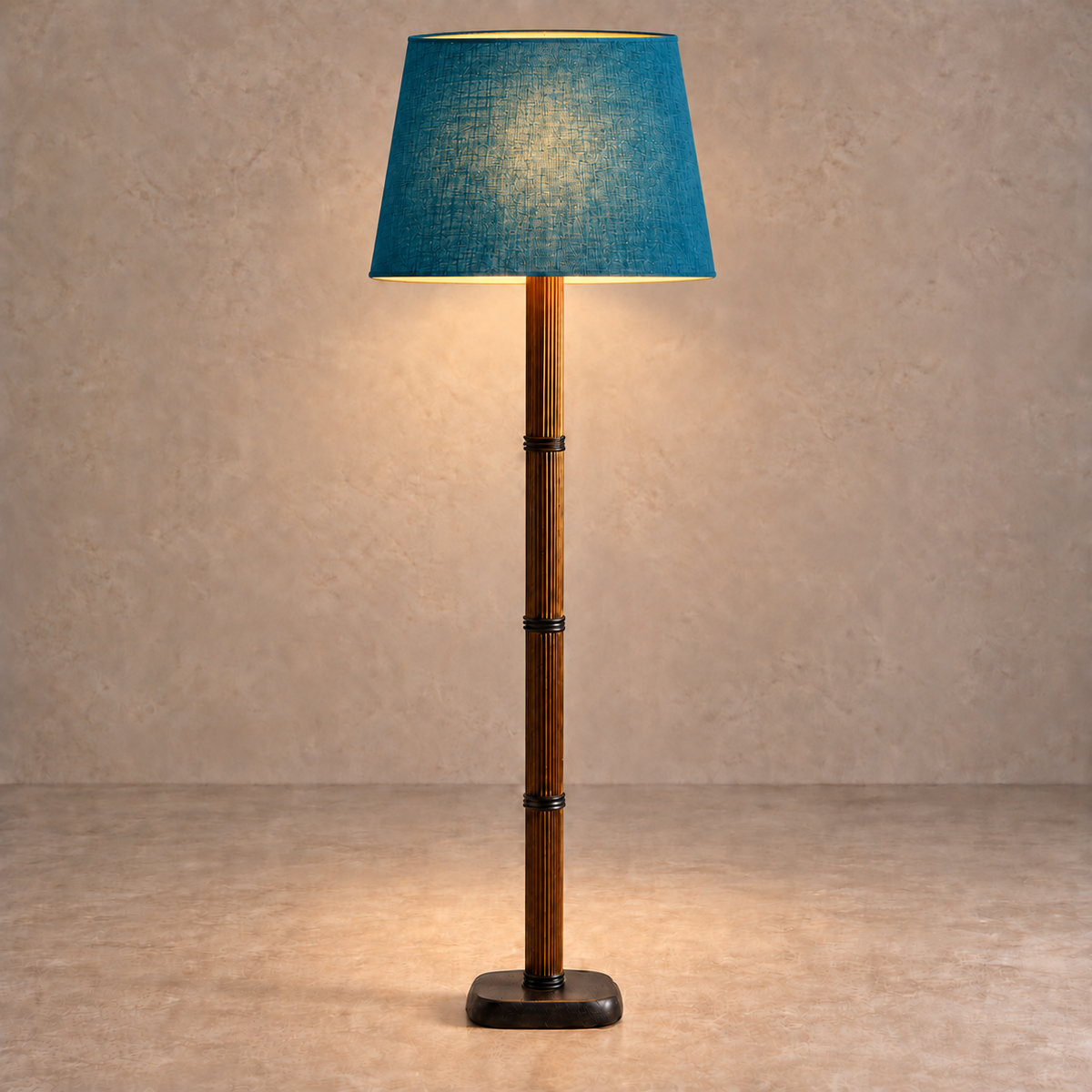 Galerie Fluted Column Floor Lamp with petrol blue linen shade, illuminated in natural daylight.