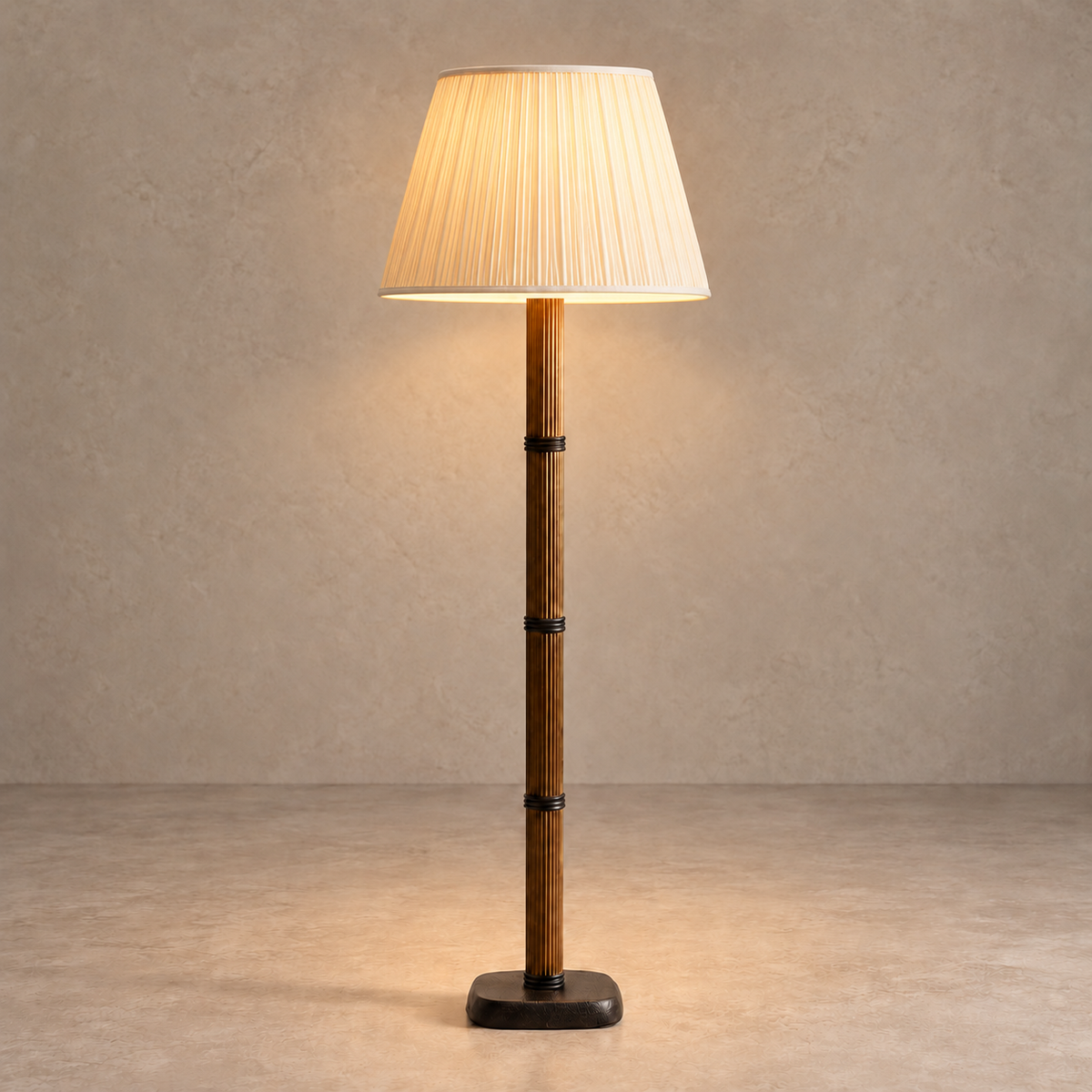 Galerie Fluted Column Floor Lamp with cream fine pleated shade, illuminated in natural daylight.