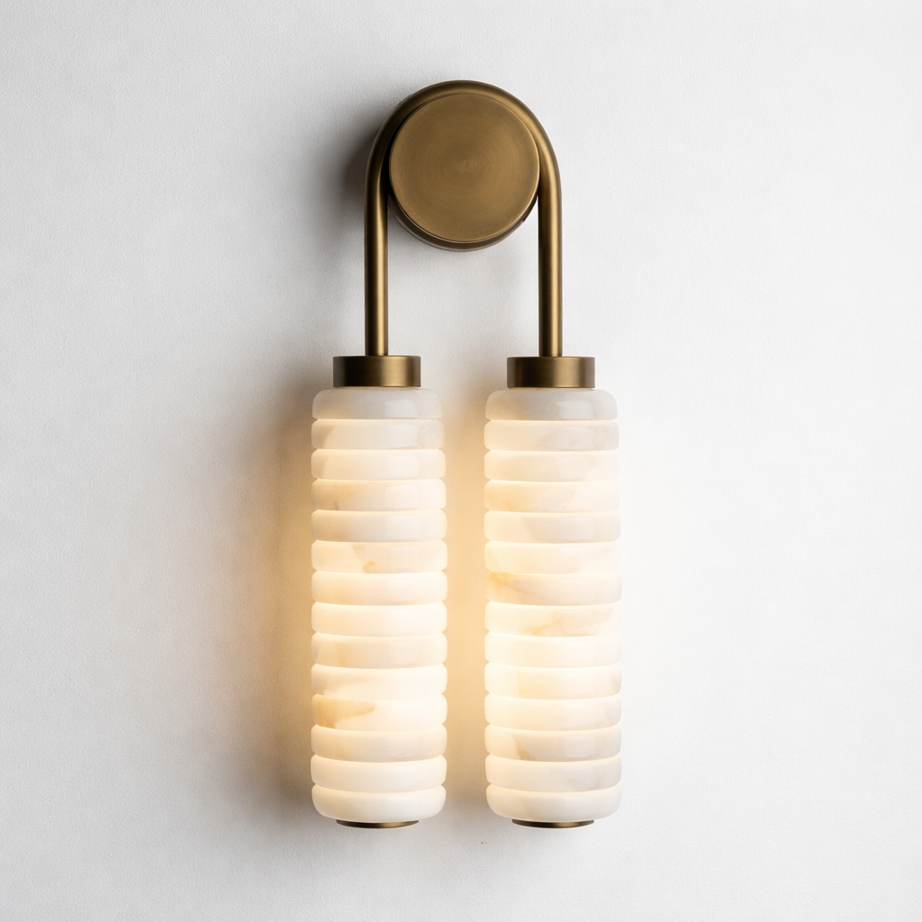 Wall-mounted light fixture with ribbed glass shades on a white background