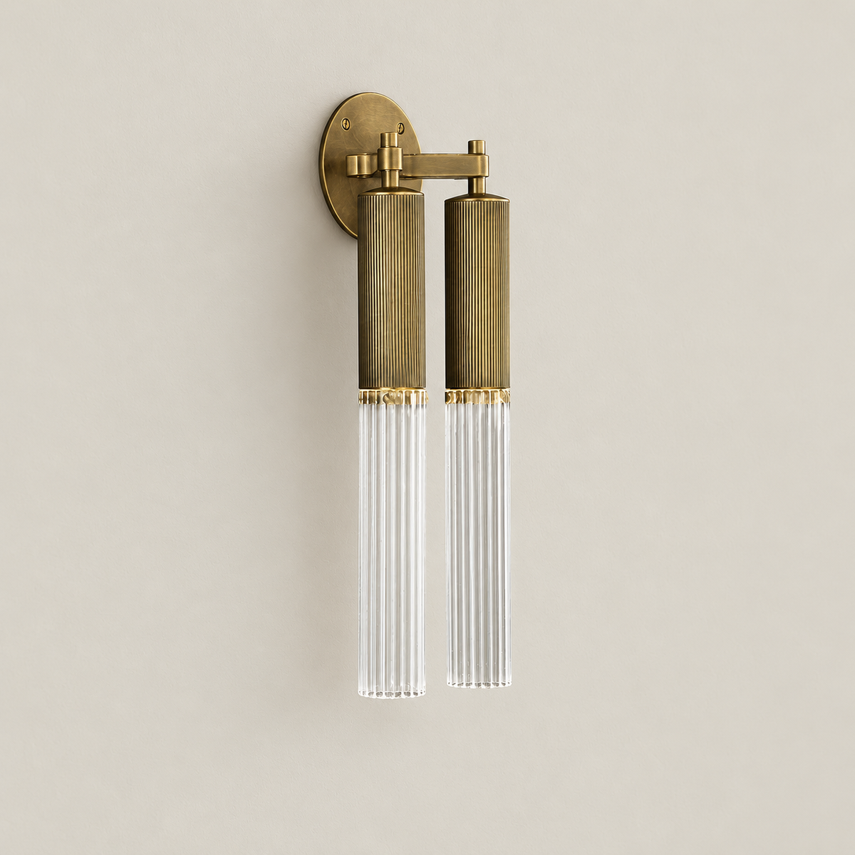 Flume double brass and ribbed glass wall light switched off.
