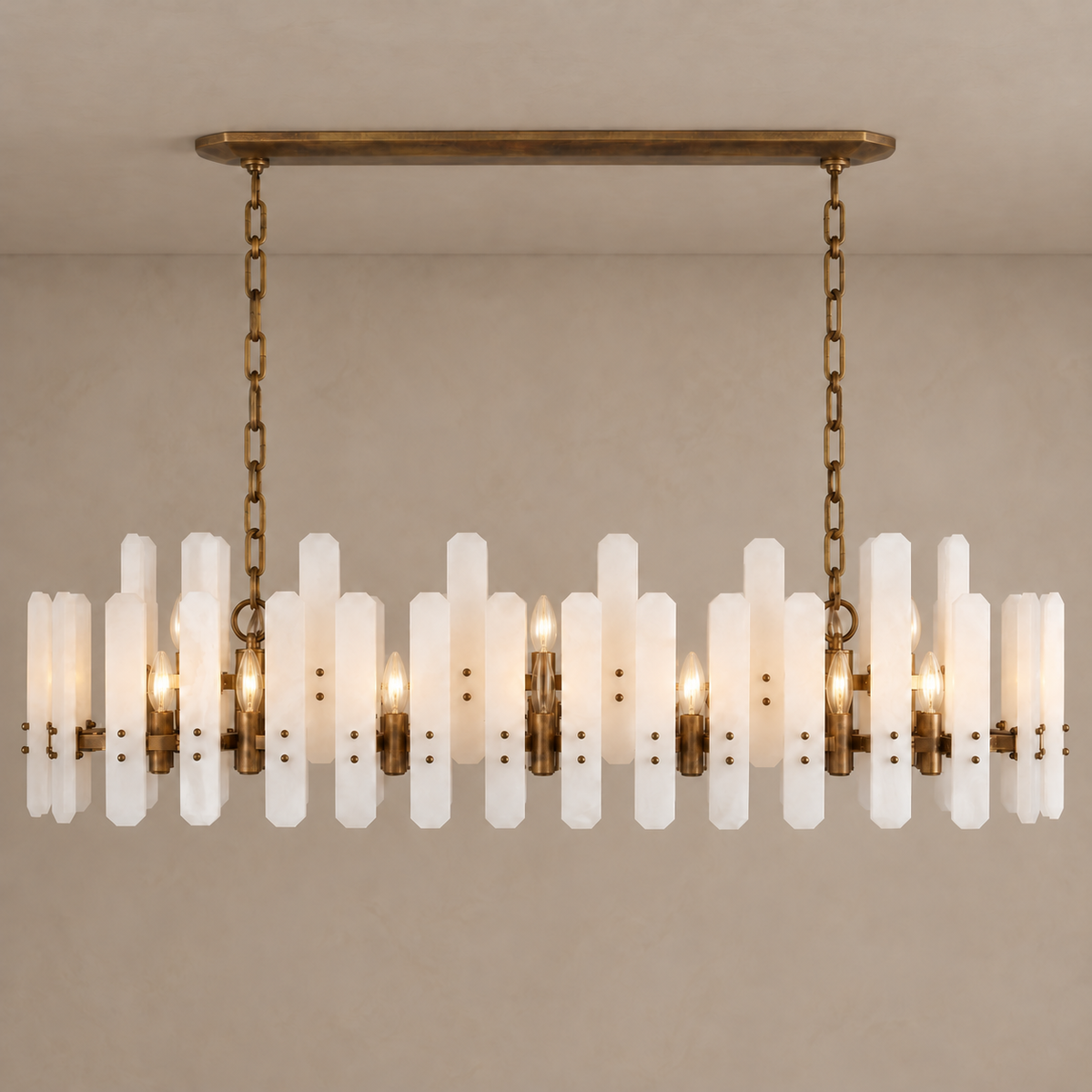 Aged bronze frosted-glass linear chandelier with its candle bulbs lit.
