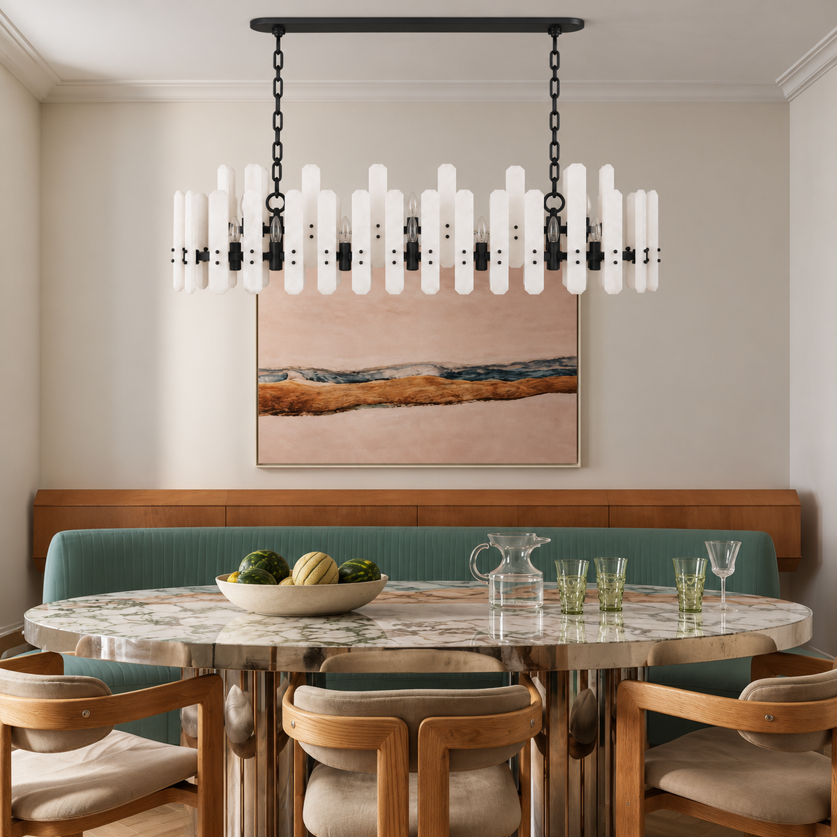 Black frosted-glass linear chandelier above an oval marble dining table with a green banquette.