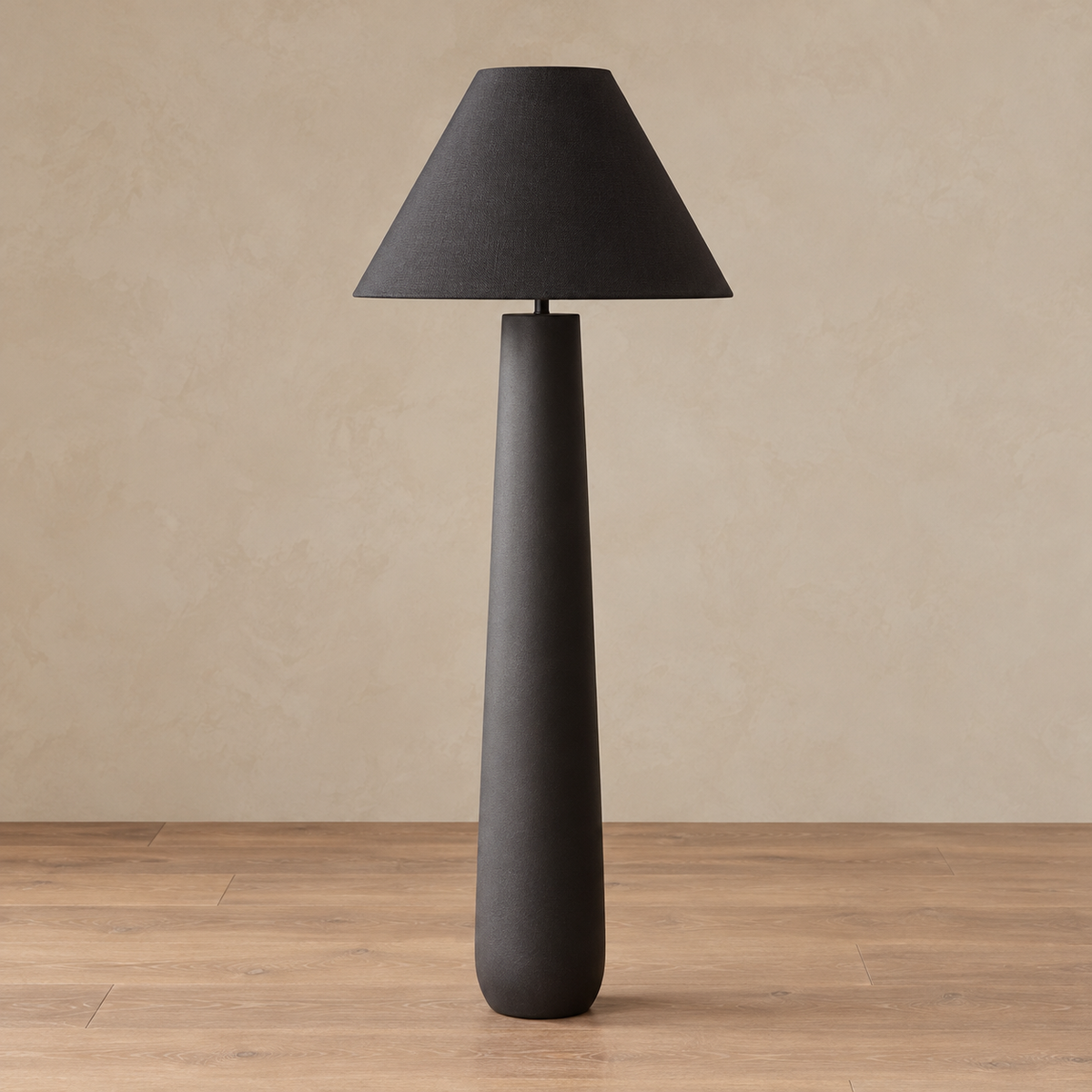 Fungo Bianco floor lamp in black with its light off, showing the rounded foot and tapered shade.
