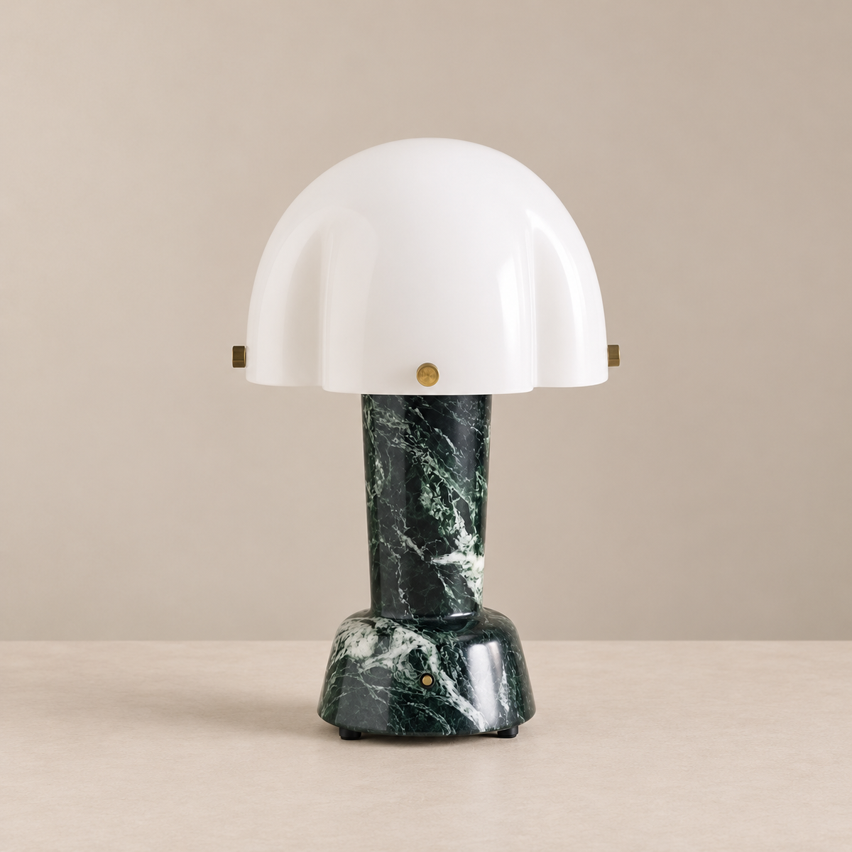 Green Marble Table Lamp, switched off, on a beige background.