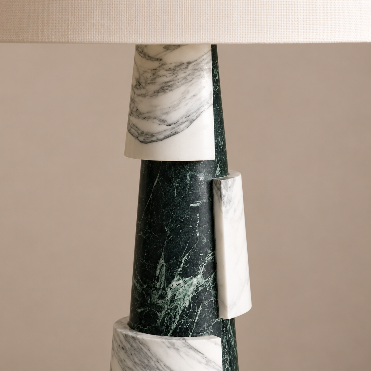 Close-up of the alternating green and white marble sections.