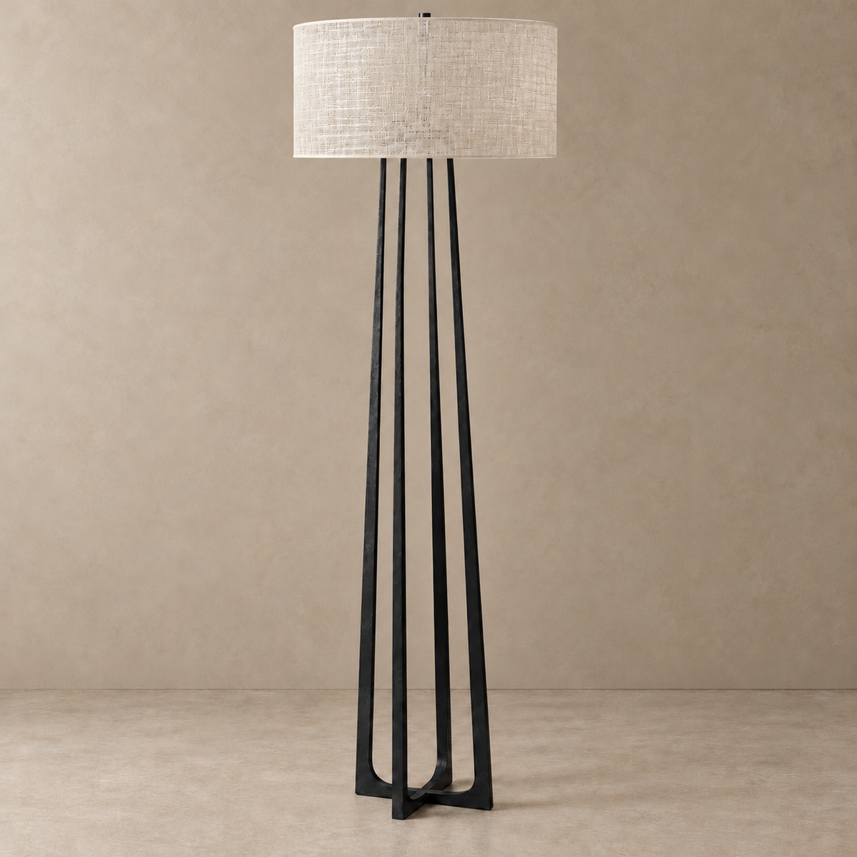 hammered black stainless steel floor lamp unlit with a single-layer silk abaca drum shade