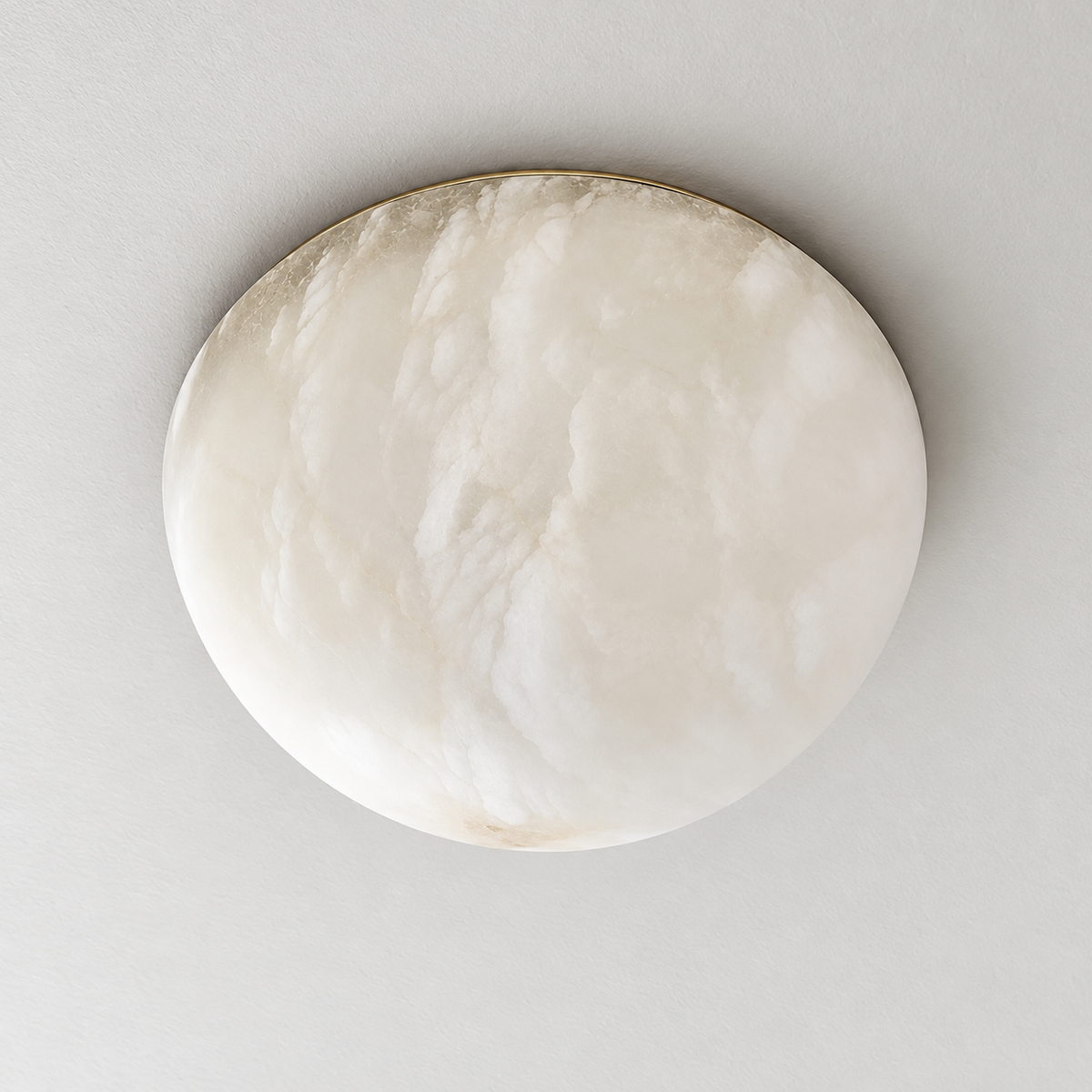 Honed alabaster dome flush mount unlit, with soft natural mineral bands.