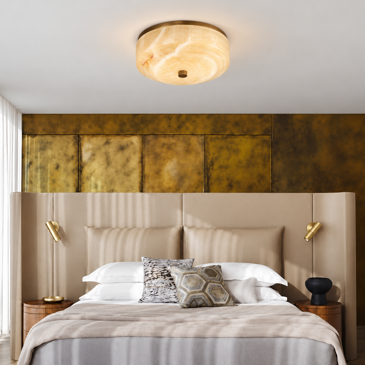 Honey onyx flush mount installed above an upholstered bed.