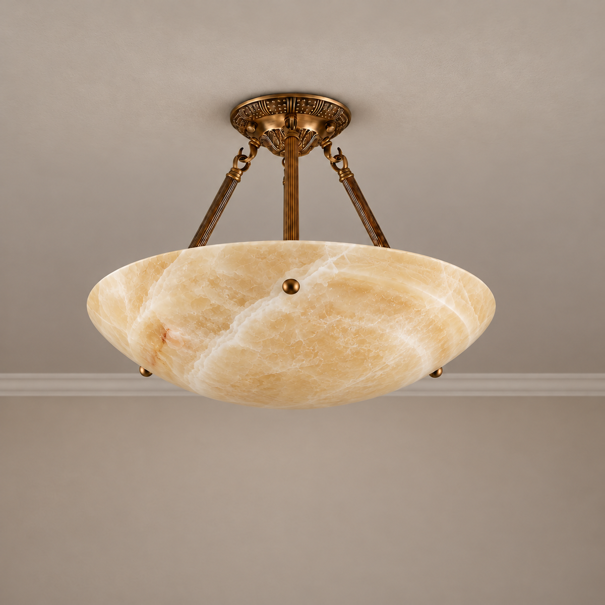40 cm honey onyx semi-flush light with ornamental brass supports, switched off.
