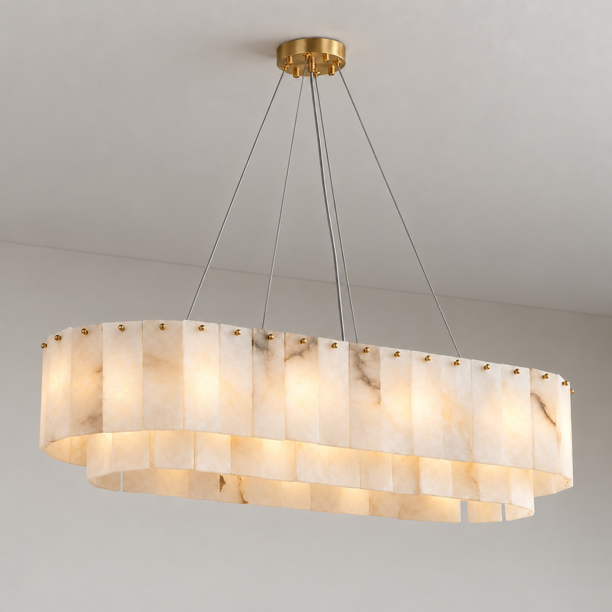 Illuminated Joan oval alabaster chandelier with readable cloudy mineral patterns.