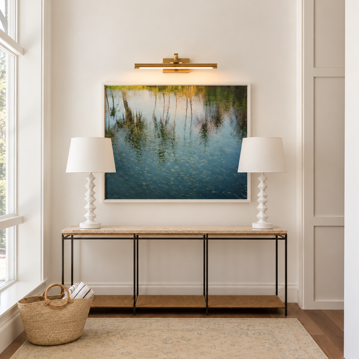 Brass linear LED picture light, installed above a console