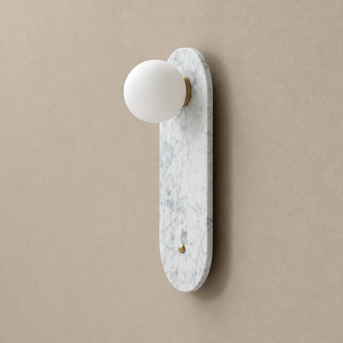 White marble wall sconce with frosted glass globe and brass fittings, switched off.