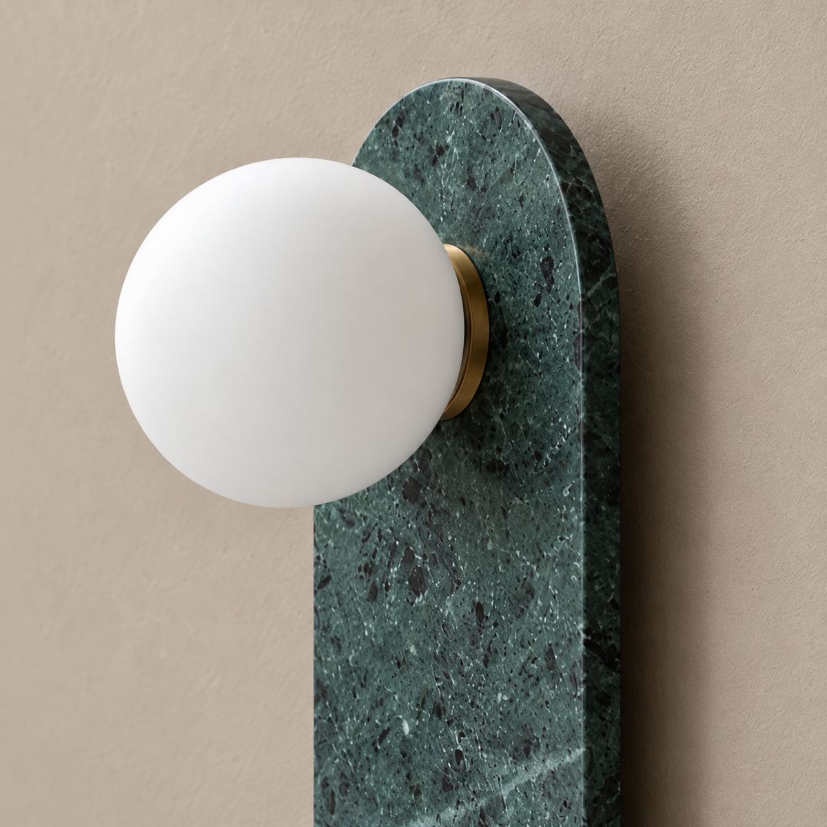 Close view of green marble, the brass collar and frosted glass globe.