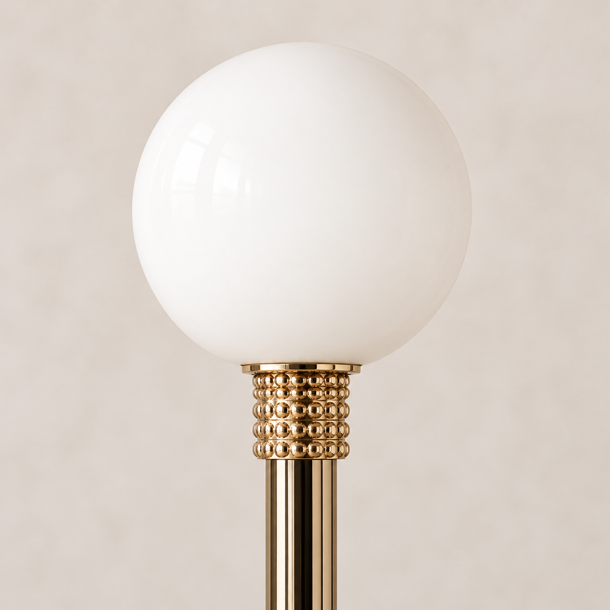 White opaline glass globe with a textured gold-tone collar and polished metal stem on the Milano floor lamp.