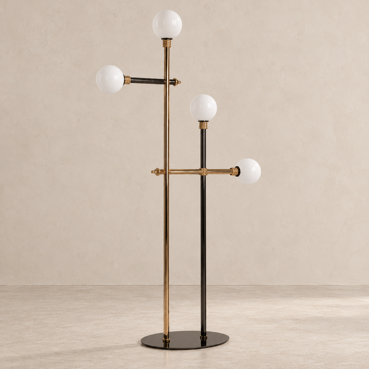 Angled view of the Milano floor lamp showing four opaline globes, metal crossbars and an oval base.