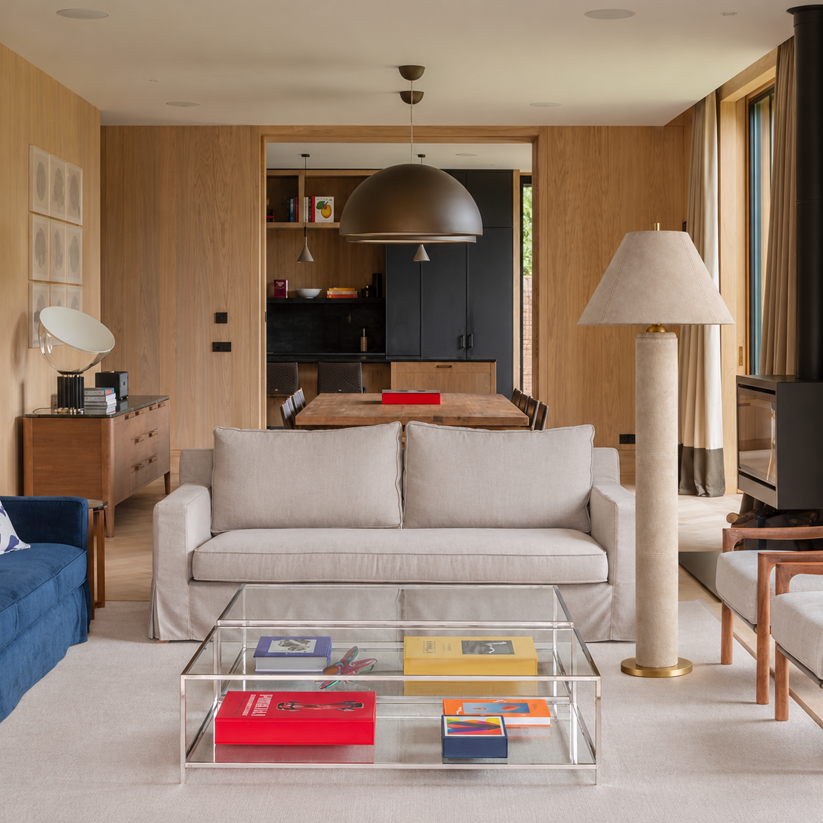 Beige Montalcino leather floor lamp beside a cream sofa in a timber-panelled living room.