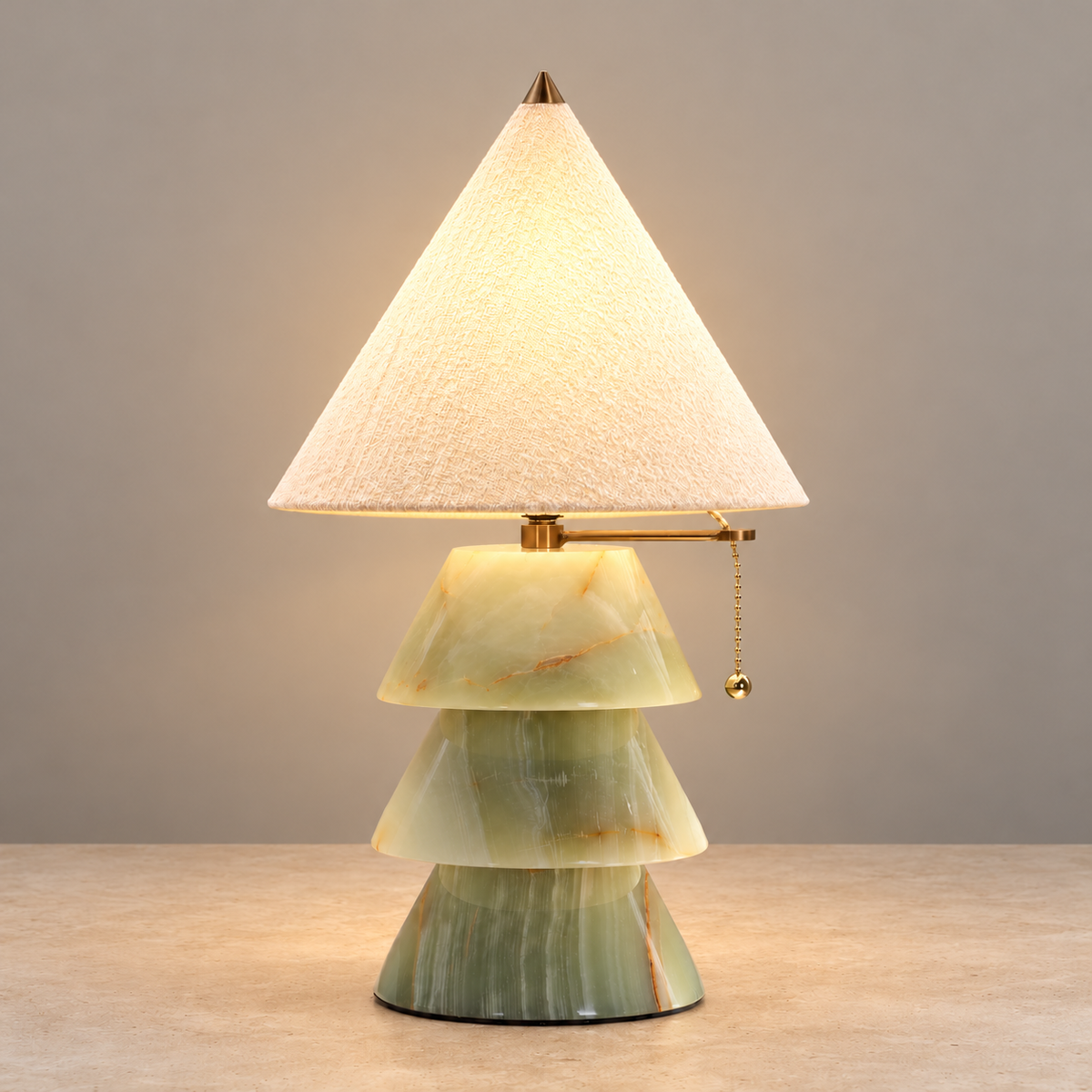 Pagoda jade-green table lamp illuminated on a beige background