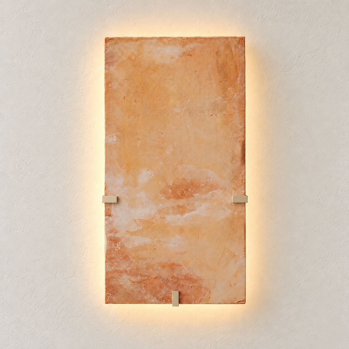 Parefeuille Petite onyx wall sconce illuminated with a soft halo behind the stone slab.