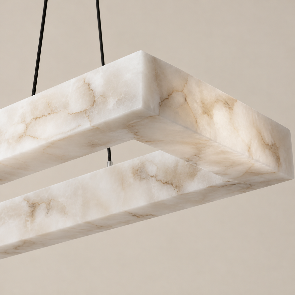 Close view of the rectangular chandelier's alabaster corner and natural mineral veining.