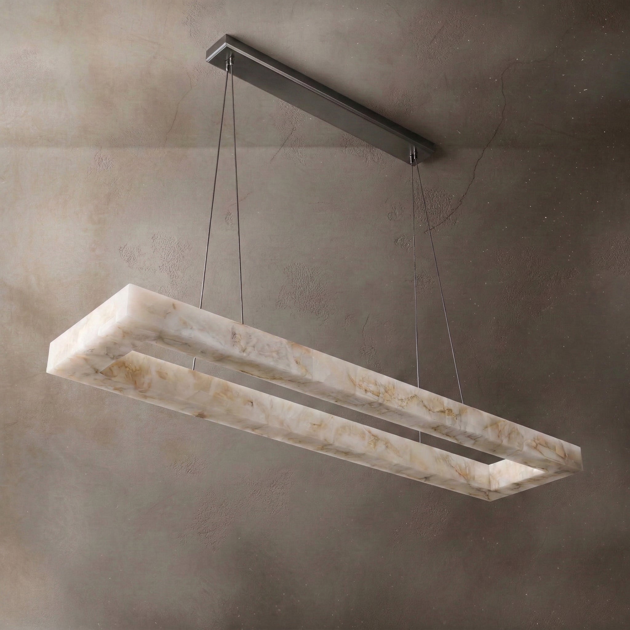 Rectangular alabaster linear chandelier over a dining table