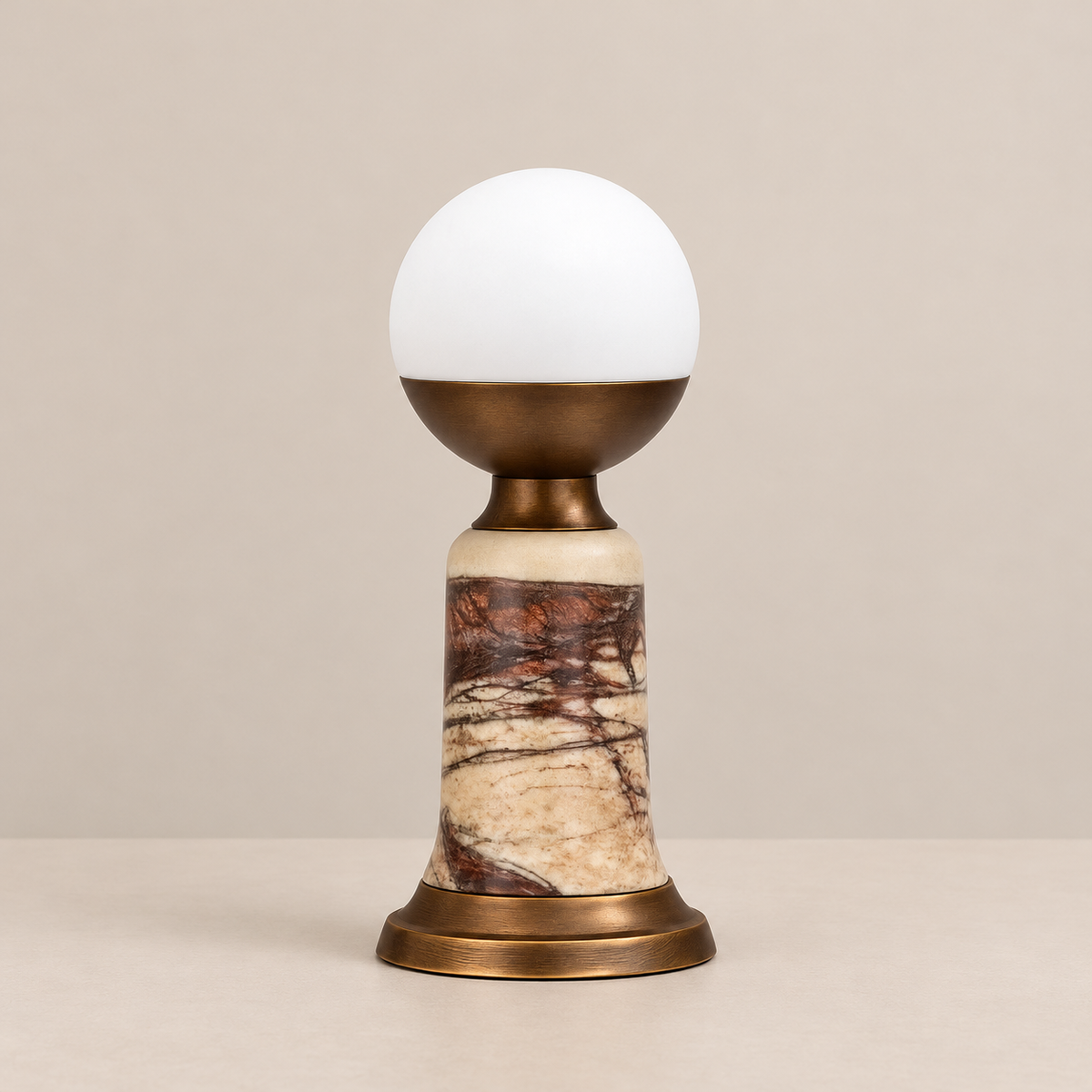 Red Marble Table Lamp, switched off, on a beige background.
