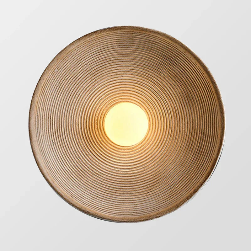 Round wall light glowing warm
