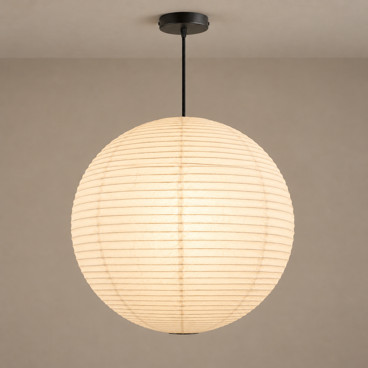 Round rice paper pendant illuminated, with its ribbing and paper seams visible