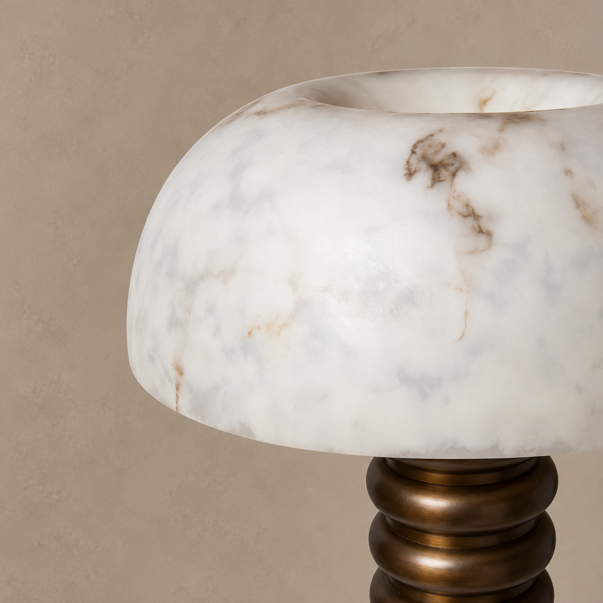 Close view of Roma's alabaster dome, showing its open top, milky clouding and sparse brown mineral markings.