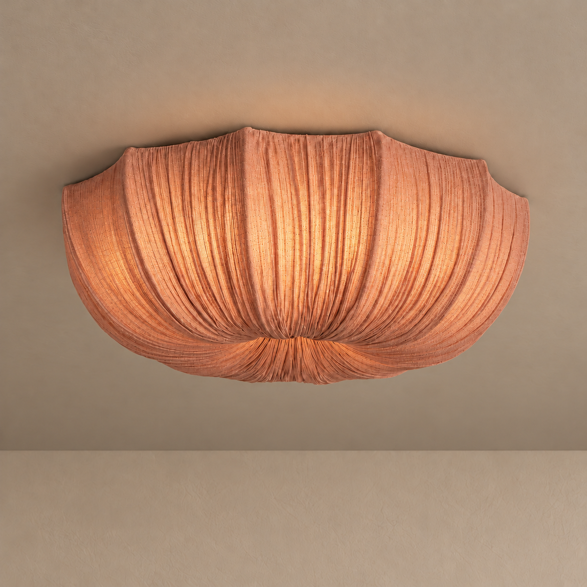 60 cm Sabina flush mount glowing through its clay-coloured gathered linen shade.