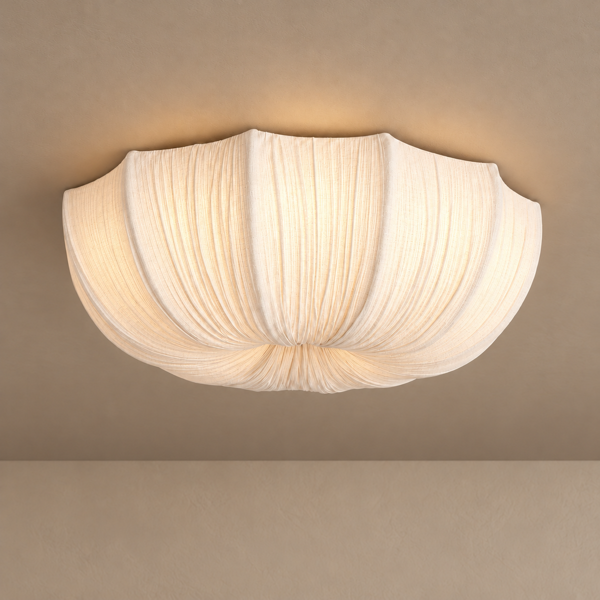 60 cm Sabina flush mount glowing through its white gathered linen shade.