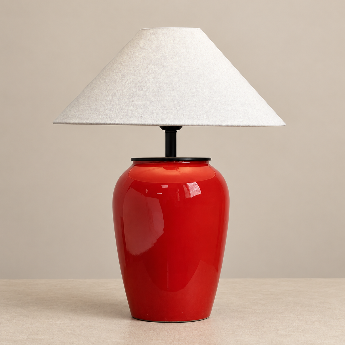 Salmeri red ceramic table lamp switched off on a beige background