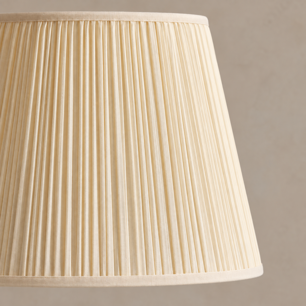 Close detail of the cream fine pleated shade.