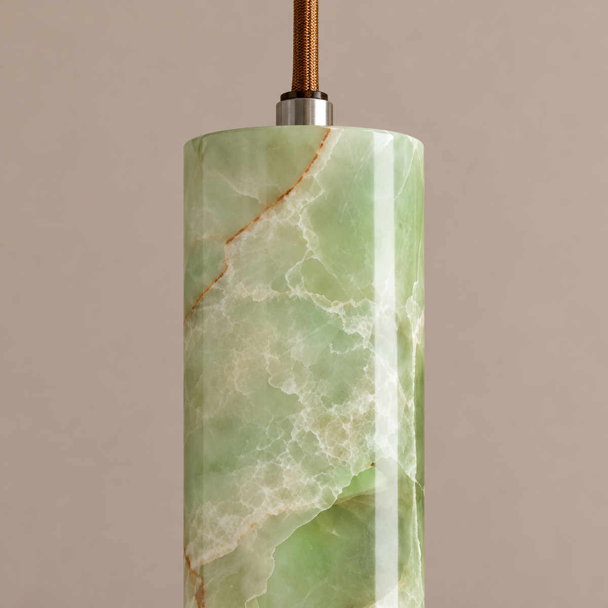 Close-up of slim green onyx cylinder and silver cable connector on the CLJ4442-GO.