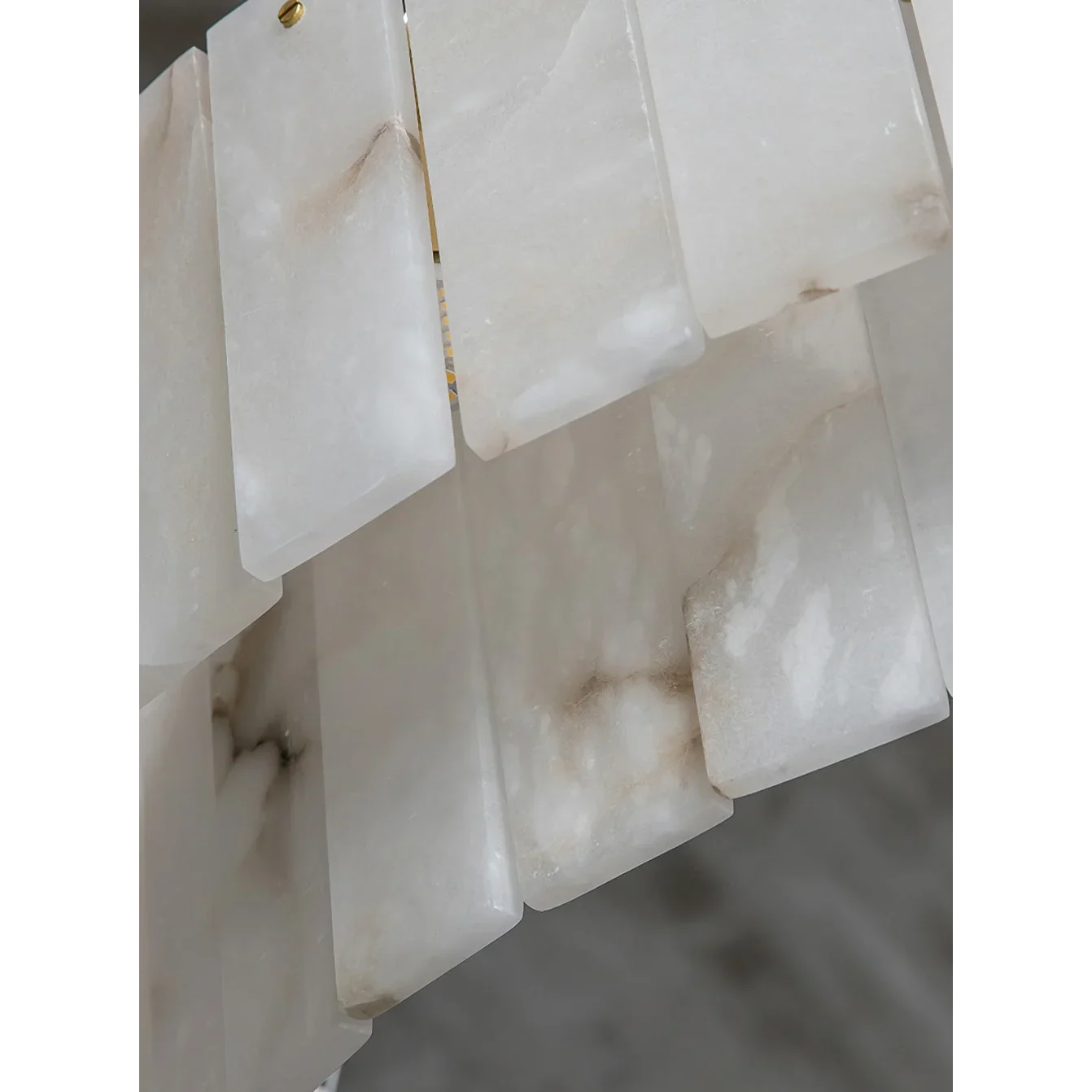 Round alabaster drum chandelier glowing warm