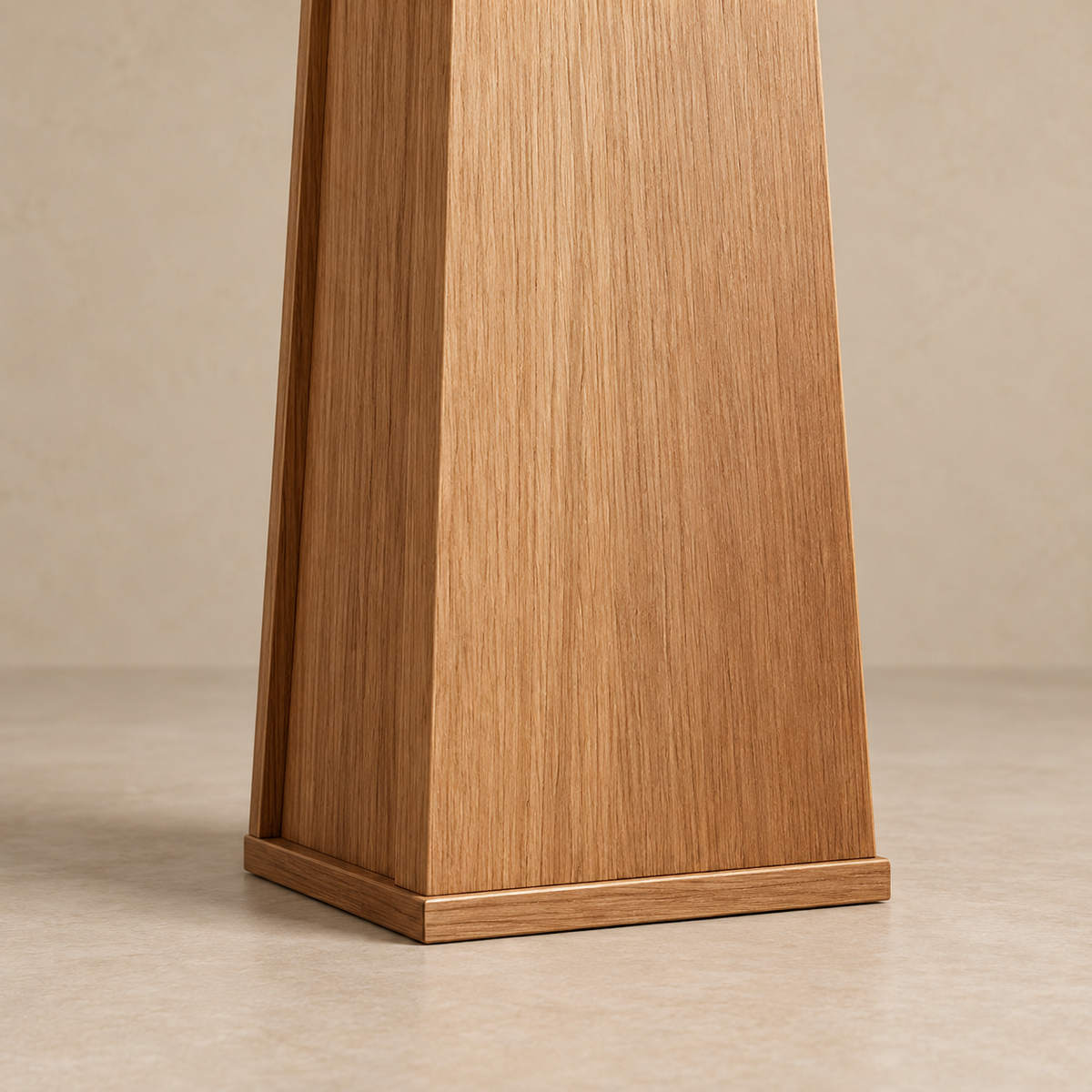 Detail of the tapered wood column, vertical grain and square plinth.