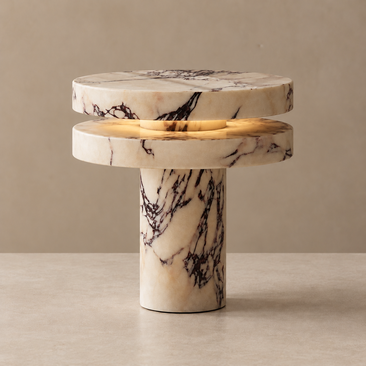 Marble Table Lamp, illuminated, on a neutral beige background.