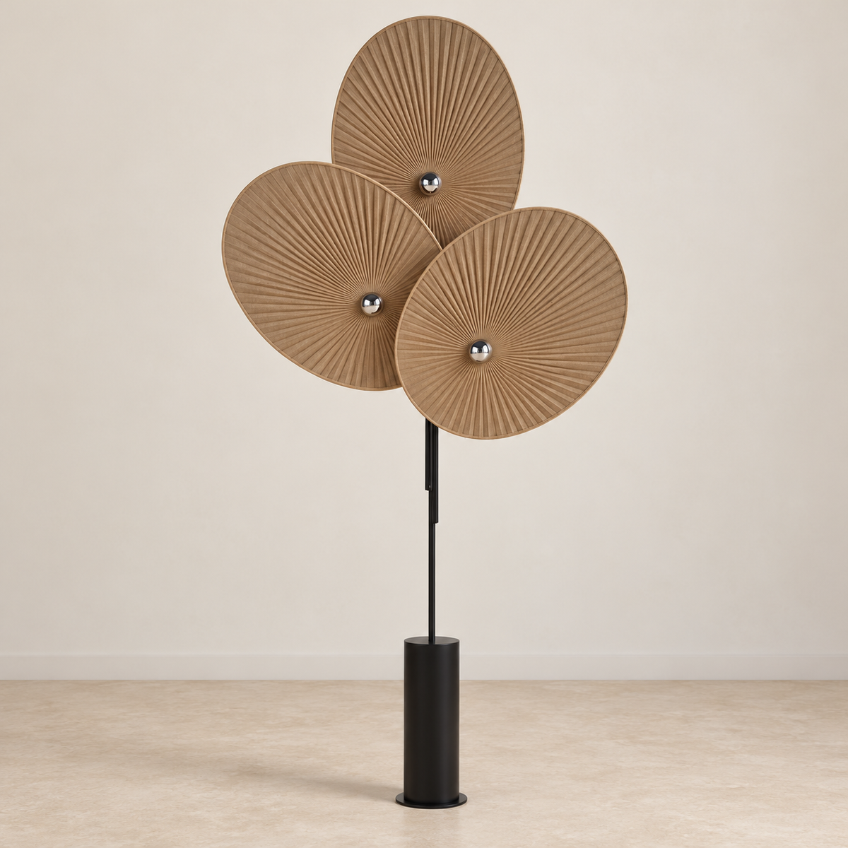 Svelo floor lamp with three brown pleated shades and black cylindrical base, switched off.