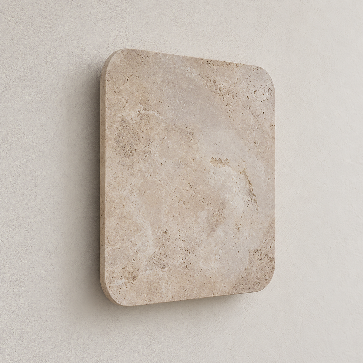 Oblique view of the travertine panel mounted on a beige plaster wall.