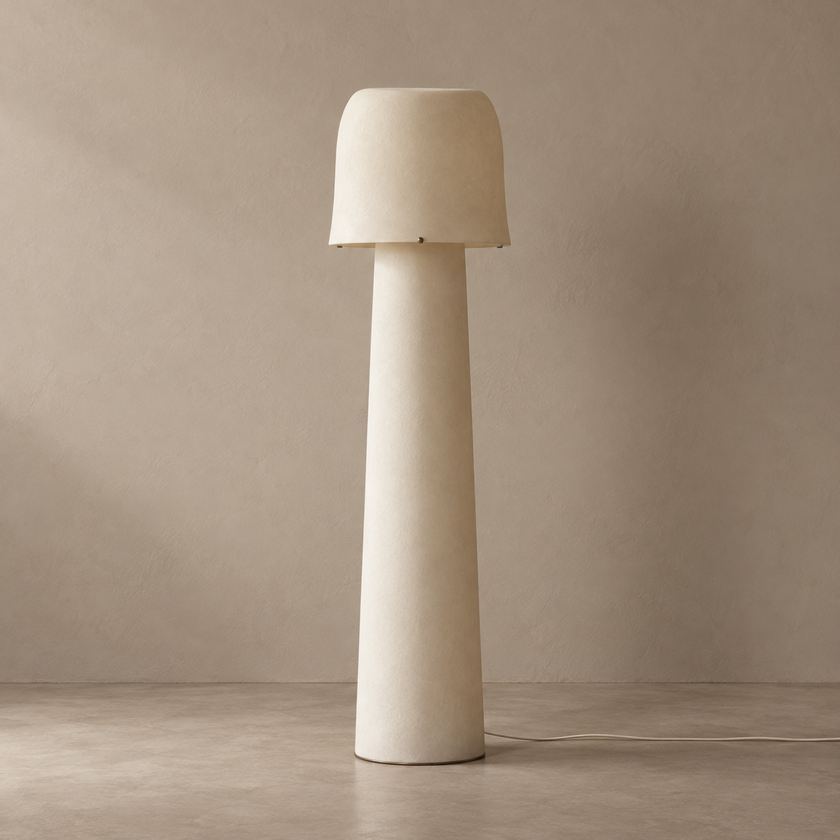 Tibur ivory resin floor lamp switched off against a stone-beige background