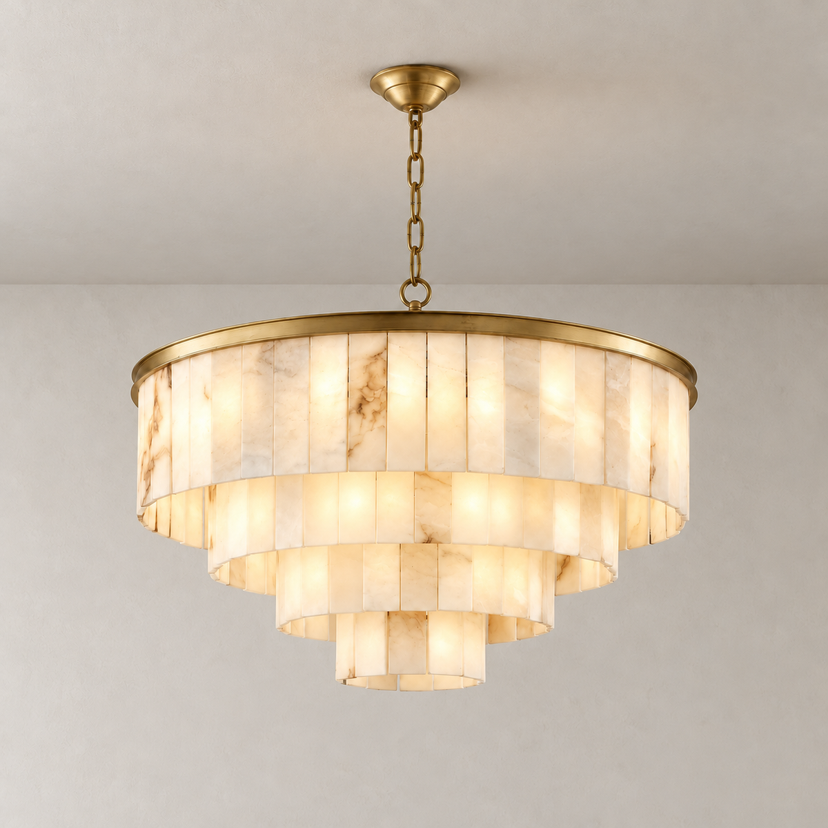 Four-tier brass alabaster chandelier illuminated with its chain and ceiling canopy.