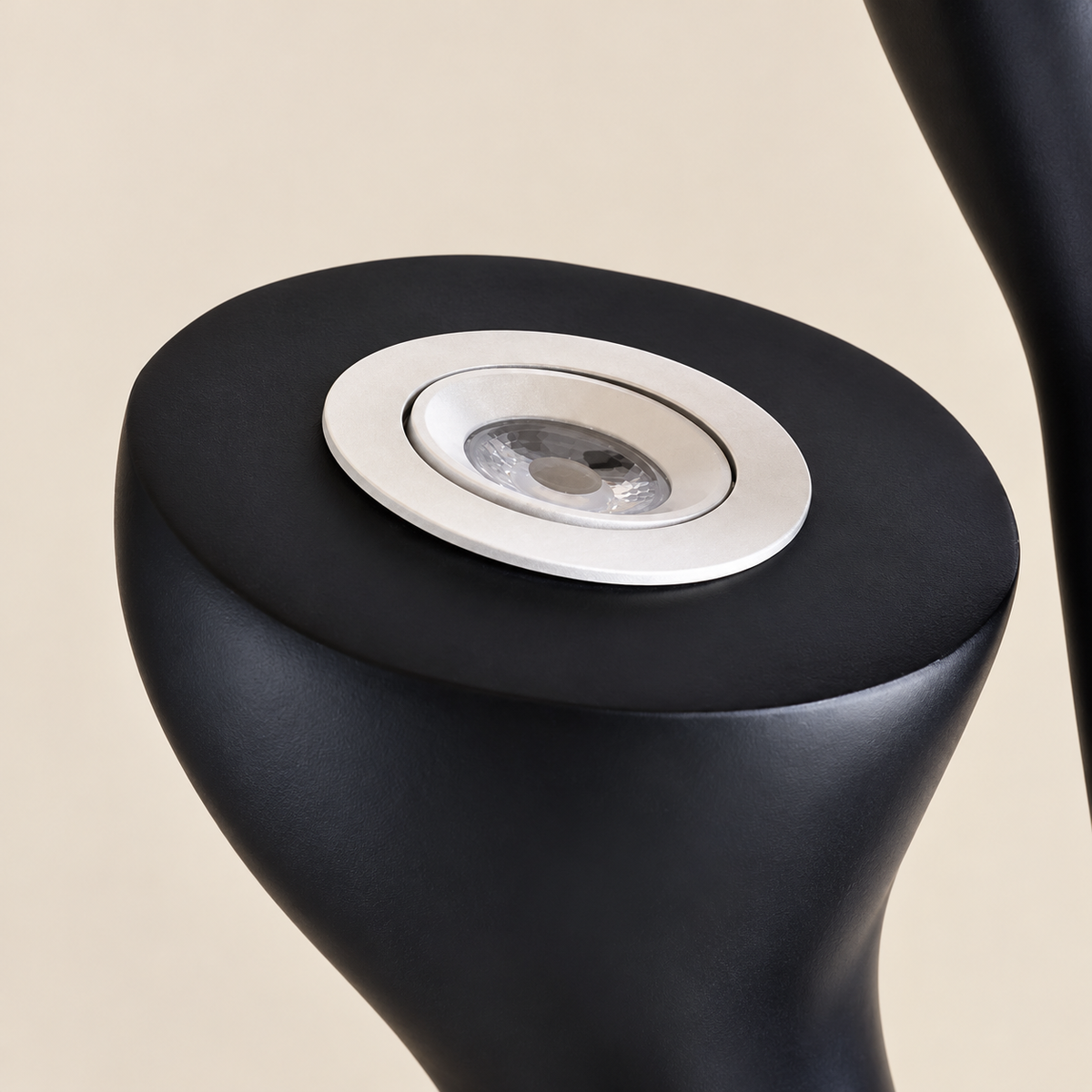 Close-up of the upward-facing LED lens inside the Tree floor lamp's black resin cup.