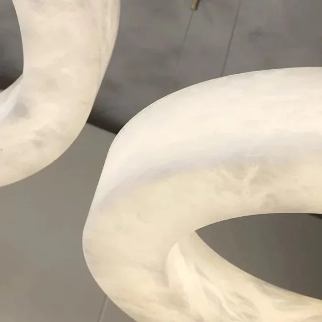 Triplo alabaster chandelier glowing warm
